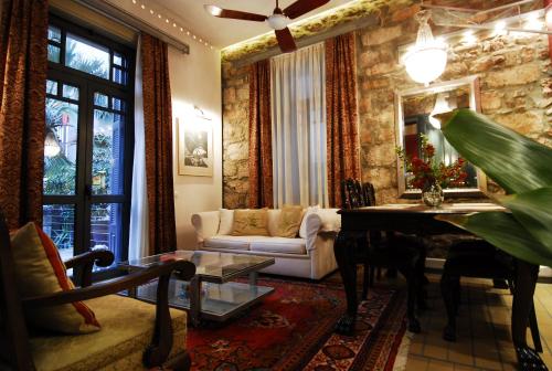 A seating area at Central Athens Period House with Pool