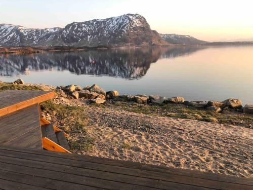 a view of a body of water with a mountain at Amazing Sea House in magic Lofoten in Vestvågøya