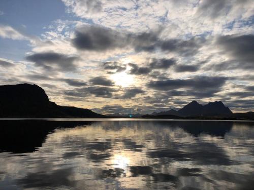 a cloudy sky over a large body of water at Amazing Sea House in magic Lofoten in Vestvågøya