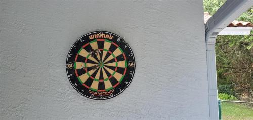 a dart board on the side of a wall at Sunset Cove in Clermont