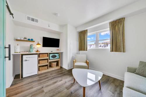 a living room with a couch and a table at Madison Resort Wildwood Crest in Wildwood Crest