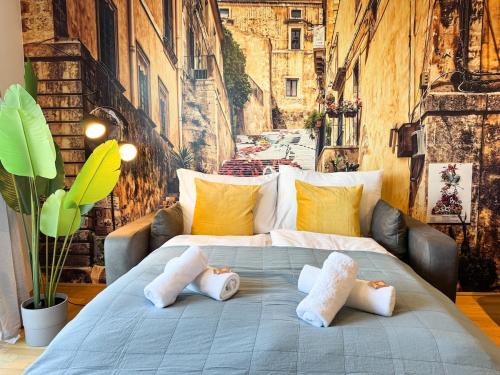 a large bed with two pillows on it in a room at Cozy & Modern 2 BR Apartment in peaceful Area in Vienna