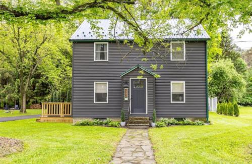 a black house with a porch and a yard at Watkins Glen Luxury Escape on Seneca Wine Trail in Watkins Glen