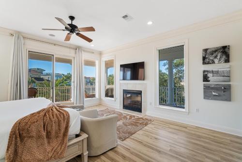 a bedroom with a bed and a fireplace at Hog Heaven in Destin