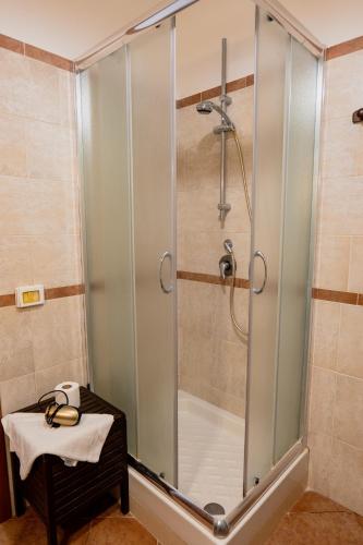 a shower with a glass door in a bathroom at Agriturismo Baglio San Pietro in Nicosia