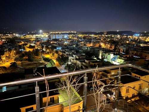 a view of a city at night with lights at Sitenest Suites in Islamabad