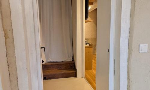 an open door to a room with a shower curtain at La Maison de Pérouges in Pérouges