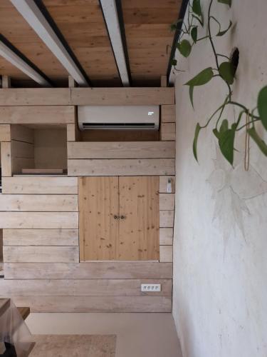 a room with wooden walls and a wooden door at La Maison de Pérouges in Pérouges
