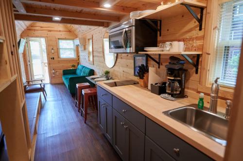 a kitchen in a tiny house with a sink at Mount Hood Village in Welches