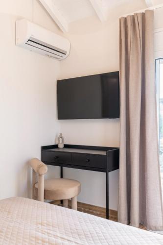 Ένα ή περισσότερα κρεβάτια σε δωμάτιο στο Serelion Portoheli