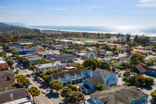 an aerial view of a small town with the ocean at Miramar Penthouse Coastal Elegance in the Heart of Half Moon Bay in Half Moon Bay