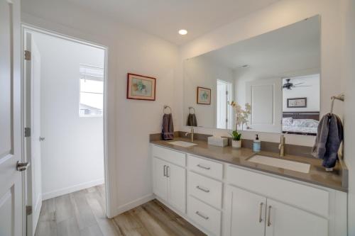 a bathroom with a sink and a large mirror at Pool, Park and Peace Skyview Landing in Eagle! in Eagle