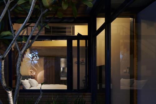 a room with a bed in a room with a window at 日月潭 3JD home 一館 in Yuchi
