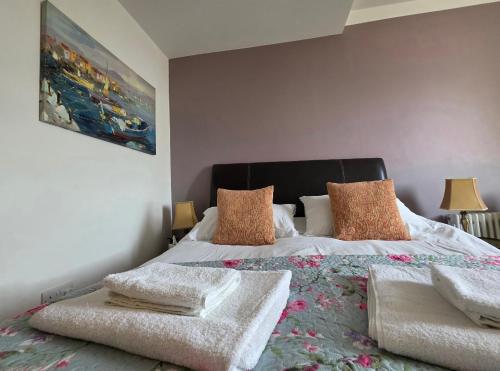 a bedroom with a bed with pillows on it at The Steam Packet in Littlehampton
