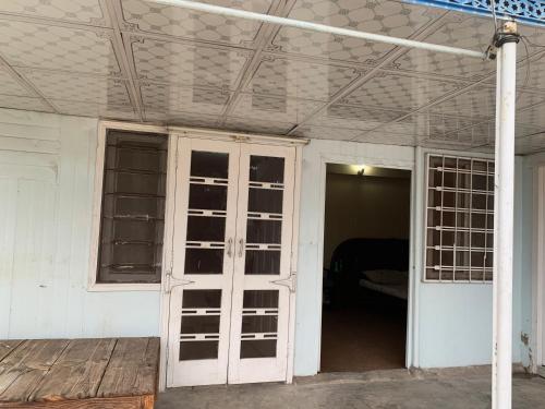 an open door to a room with a porch at Private Retreat in Muzaffarabad