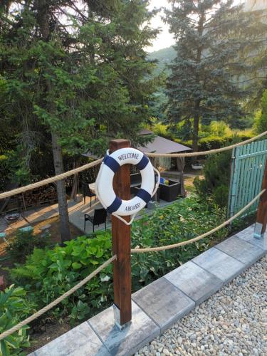 a life preserver on a fence with a picnic table at Villa Evetes in Jablonov nad Turnou