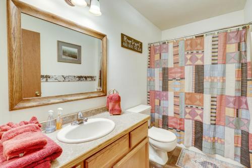 a bathroom with a sink and a toilet and a shower at Scenic Kootenai Forest Home with Outdoor Living Area in Rexford