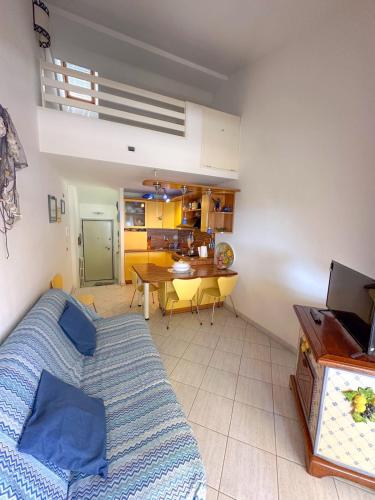 a living room with a couch and a table at La Piccola Mimosa in Sestri Levante