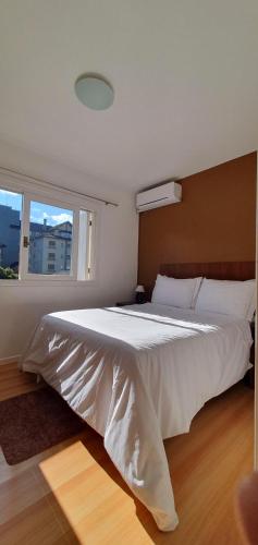 En eller flere senge i et værelse på EXCELENTE Apto