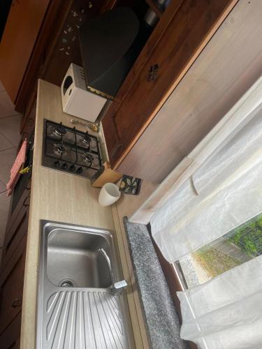 a kitchen with a sink and a counter top at cozy house in Olgiate Comasco in Olgiate Comasco