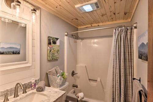 a bathroom with a shower and a sink at Modern Mtn Home*Pools*Fire Pit* in Campton