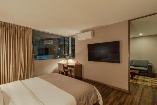 Postel nebo postele na pokoji v ubytování Sites Hotel