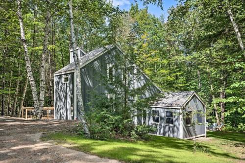 a small shed in the middle of a forest at Modern Mtn Home*Pools*Fire Pit* in Campton