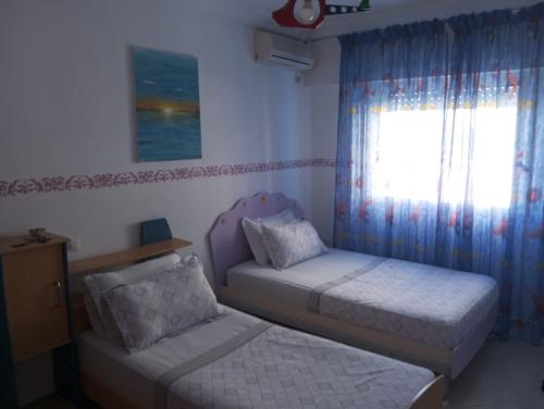 Postel nebo postele na pokoji v ubytování Grand Appartement Martil