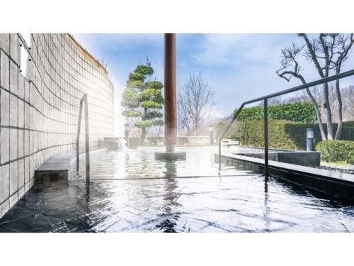 a pool of water in front of a building at Ouka no sato La-Foret Shobara - Vacation STAY 35116v in Shōbara