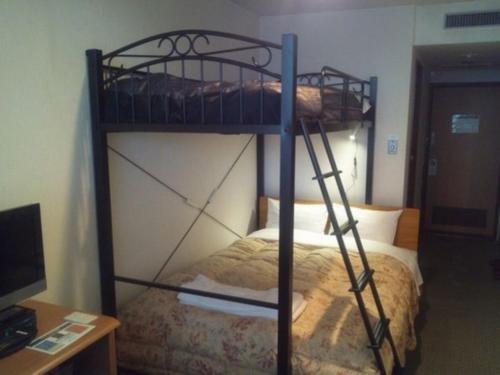 a bedroom with two bunk beds in a room at Hotel New Ohte - Vacation STAY 32395v in Hakodate