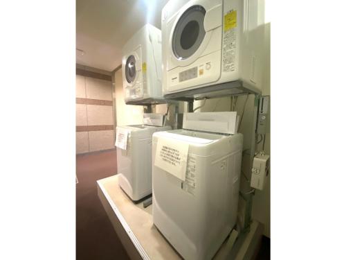 a row of appliances on a shelf in a room at Hotel Tetora Hachinohe - Vacation STAY 38082v in Hachinohe