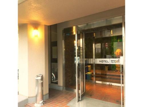 an entrance to a building with a revolving door at Hotel Tetora Hachinohe - Vacation STAY 38082v in Hachinohe