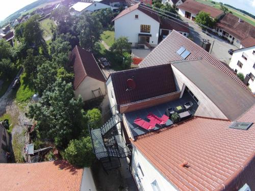 an overhead view of a house with a red roof at Landgasthof Weberhans in Harburg