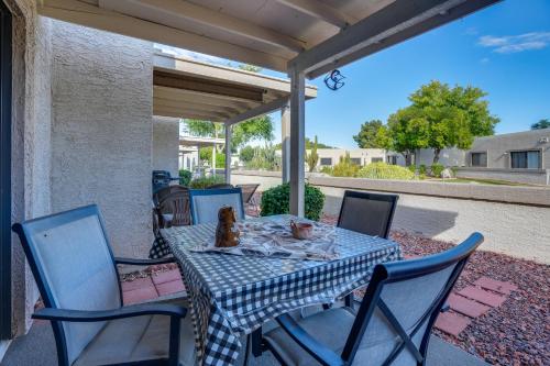 a table and chairs on a patio at Patio and Pool Access Golf Getaway in Peoria in Peoria