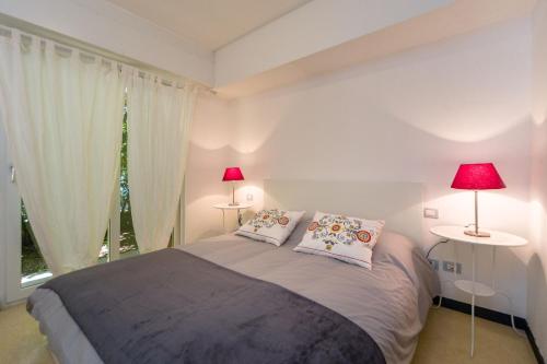 Voodi või voodid majutusasutuse Cinque Terre Moneglia Apartments toas