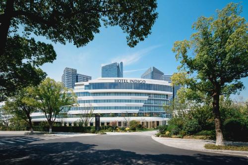 a view of the front of the hotel indigo headquarters at Hotel Indigo Suzhou Jinji Lake by IHG in Suzhou