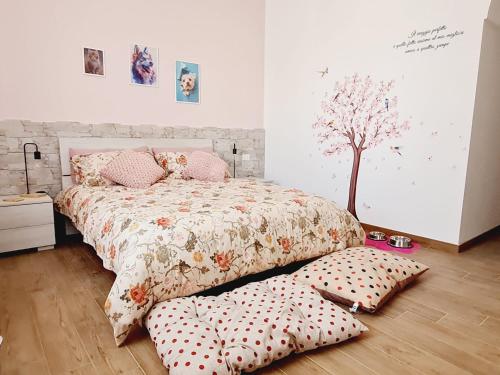 a bedroom with a bed and pillows on the floor at La Chicca di Milu' for Pet Lovers in Alcamo