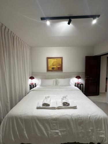 En eller flere senge i et værelse på CasaCharcas Hotel Boutique