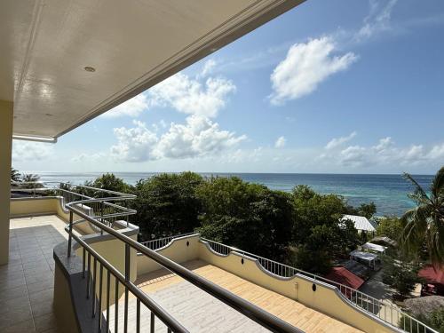 a balcony with a view of the ocean at Noah Family Room with Seaview Balcony in Himmafushi