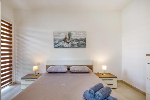 Postel nebo postele na pokoji v ubytování Sliema Spacious Apartment