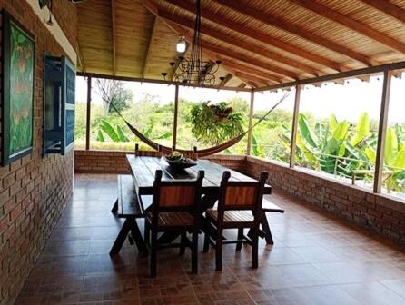 a dining room with a table and chairs in a house at Finca VILLA DEL SOL in Alcalá