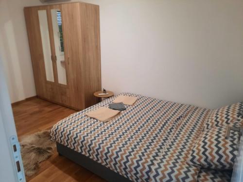 Postel nebo postele na pokoji v ubytování Zmaj lux