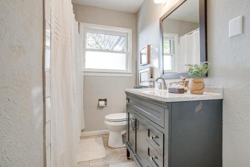a bathroom with a sink and a toilet and a mirror at The Westside Collective in Westworth