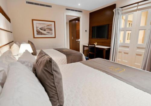 Postel nebo postele na pokoji v ubytování Central Hotel Panama Casco Viejo