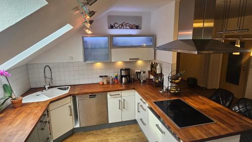 a kitchen with a sink and a counter top at Ferienwohnung am Stadtpark #2, 2BR, 109m2, Parkplatz in Ilmenau