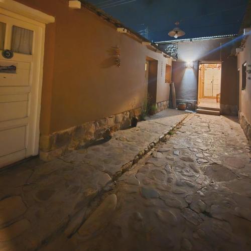 an empty hallway of a building with a door at Mestiza Hostal in Humahuaca