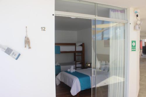 Ένα ή περισσότερα κρεβάτια σε δωμάτιο στο Las Fragatas Casa Hotel