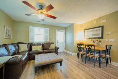 a living room with a couch and a table at Windy Hill Villa 1 - Beach Barnacle in Myrtle Beach