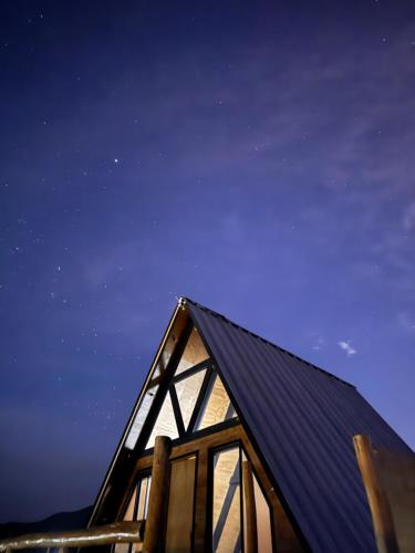 a house with a black roof at night at Las Alpinas del valle in Talca