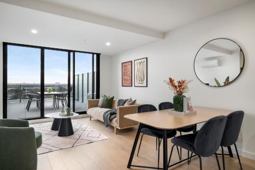 a living room with a table and a mirror at Hobson Apartments by Urban Rest in Newport